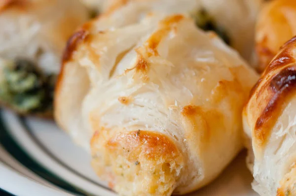 stock image A closeup of baked cheese in the dough