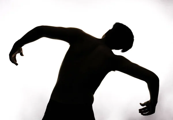 Una Silueta Joven Posando Sobre Fondo Blanco —  Fotos de Stock