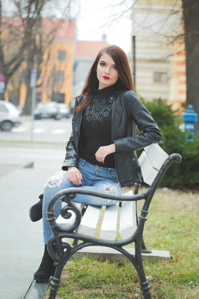 Vertical Shot Young Brunette Female Leather Coat Posing Sitting Bench — 스톡 사진