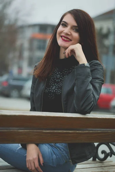 Vertical Portrait Young Brunette Female Leather Coat Posing Sitting Bench — 스톡 사진