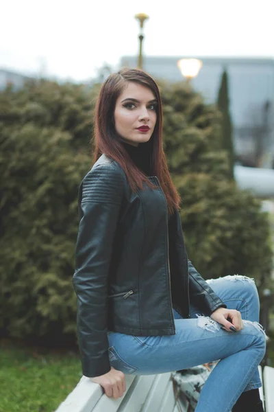 Vertical Shot Young Brunette Female Leather Coat Posing Bench — 스톡 사진