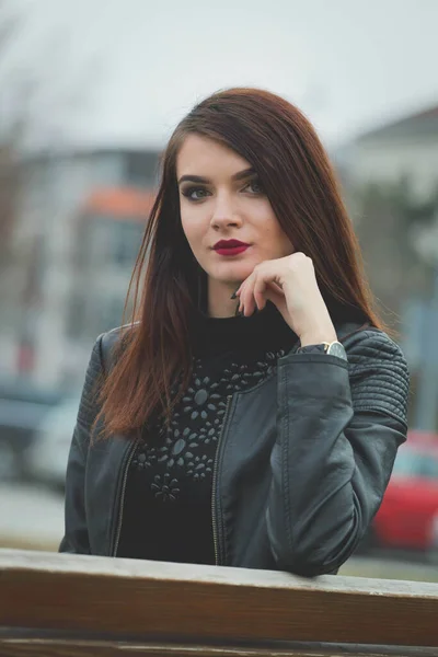 Beautiful Caucasian Female Red Lipstick Black Leather Coat Posing Park — стоковое фото