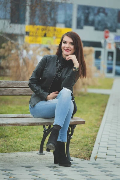 Vertical Shot Young Brunette Female Leather Coat Posing Sitting Bench — ストック写真