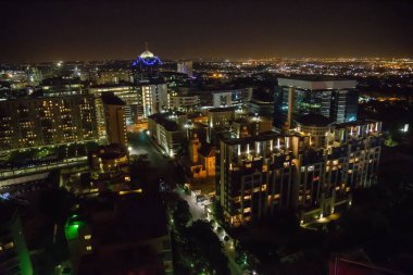 Arial view ofJohannesburg cityscape at the back with lights at night time clipart