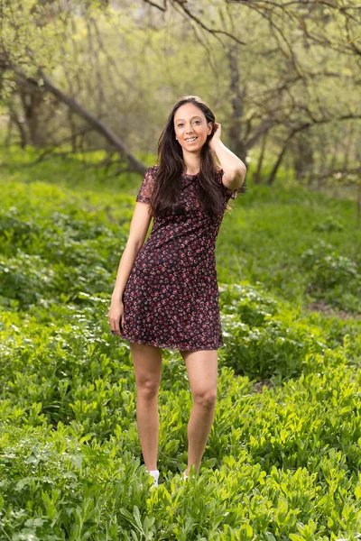 Beautiful Smiling Brunette Girl Wearing Light Summer Dress Posing Green — стоковое фото