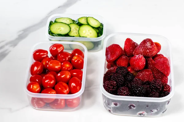 Top View Plastic Food Containers Tomatoes Cucumber Berries White Background — Stock Photo, Image