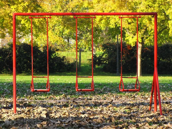 Three Red Swings Children Playground — 스톡 사진