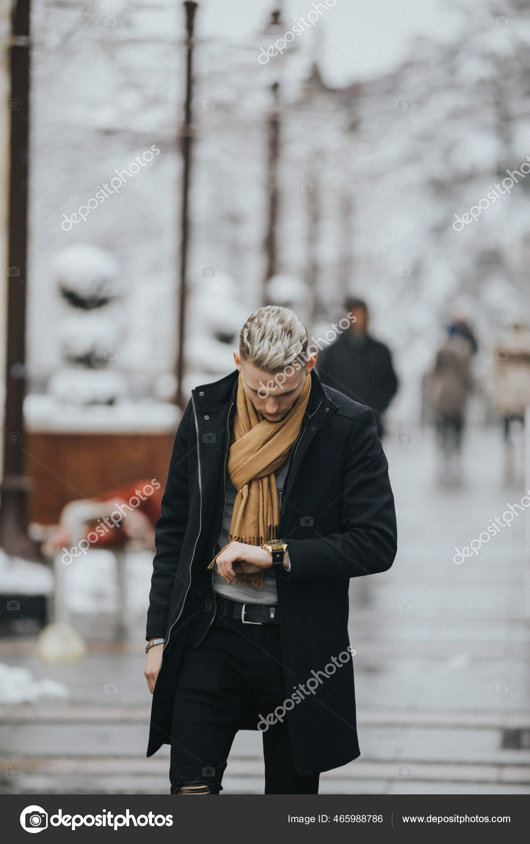 Handsome Young Man Black Winter Outfit Brown Scarf Checking His Stock Photo  by ©Wirestock 465988786