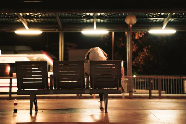 Person Wearing Coat Hood Sitting Train Station Night — Stock Photo, Image