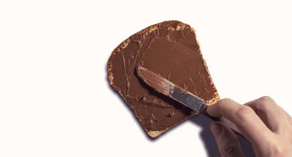 Uma Vista Superior Uma Mão Espalhando Uma Propagação Chocolate Uma — Fotografia de Stock