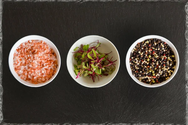 Three White Bowls Slate Background Pink Salt Micro Herbs Rainbow — Stock Photo, Image