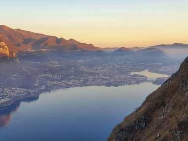 A stunning view of Lake Annone and Monte Barro natural reserve during sunset in Galbiate, Lecco province, Italy clipart