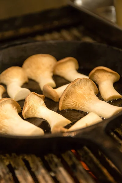 The king trumpet mushrooms frying in the pan
