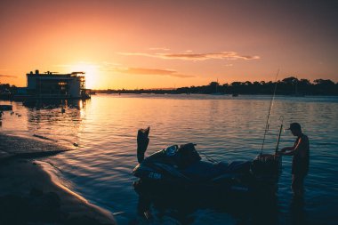 NOOSA, AUSTRALIA - Apr 17, 2021: sunset photos at the Noosa boat ramp clipart