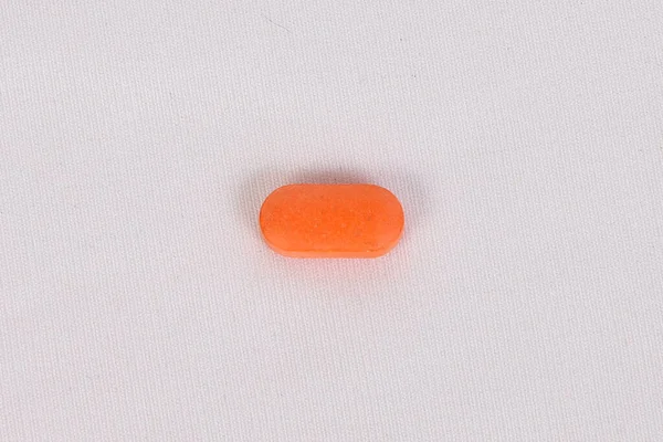 Pomarańczowa Owalna Tabletka Wyizolowana Białym Tle — Zdjęcie stockowe