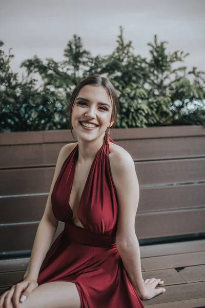 Young Attractive Caucasian Female Smiling Wearing Long Elegant Red Dress — стоковое фото