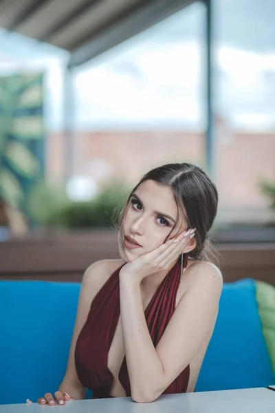 Young Attractive Caucasian Female Wearing Beautiful Elegant Red Dress Sitting — Stock Photo, Image