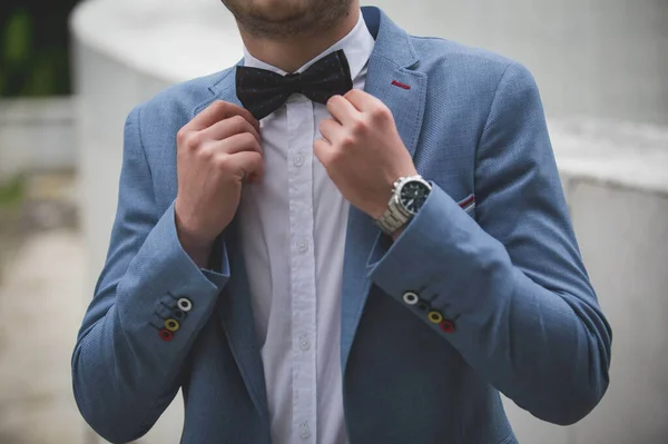 Midsection Groom Fixing His Black Bowtie Wearing Blue Suit Colorful — Stock Photo, Image