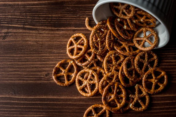 Salty Pretzels Poured Out Wooden Table Bowl — Stock Photo, Image