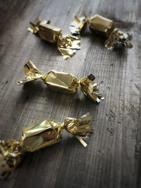 Vertical Shot Four Chocolate Gold Plated Wrapper Christmas Wooden Table — Stock Photo, Image