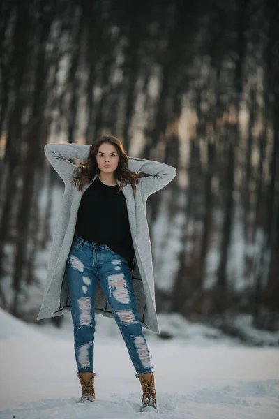 Vertical Shot Beautiful Caucasian Woman Jeans Winter Coat Posing Snow — ストック写真