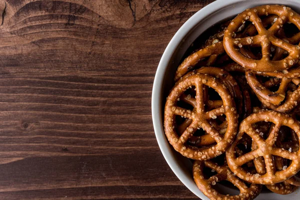 Top View Salty Pretzels Bowl Wooden Table Copy Space — Stock Photo, Image