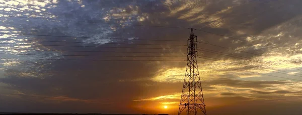 Panoramic Shot Wire Tower Facing Sunset — 图库照片