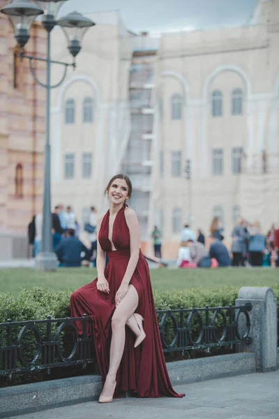 Beautiful Sexy Caucasian Woman Red Backless Gown Posing Outdoors — стоковое фото