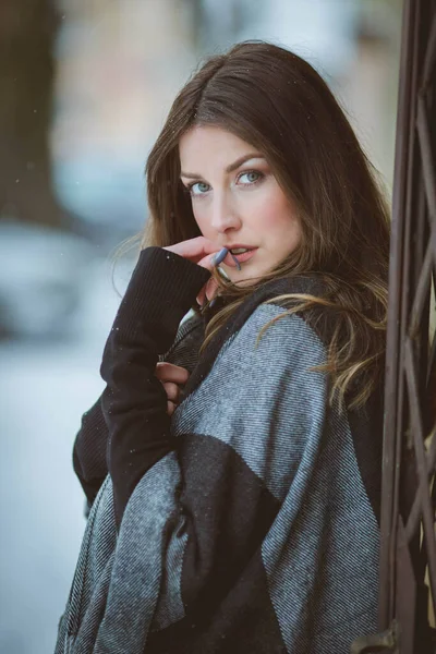 Portrait Young Woman Wearing Oversized Blanket Scarf Standing Next Metal — стоковое фото