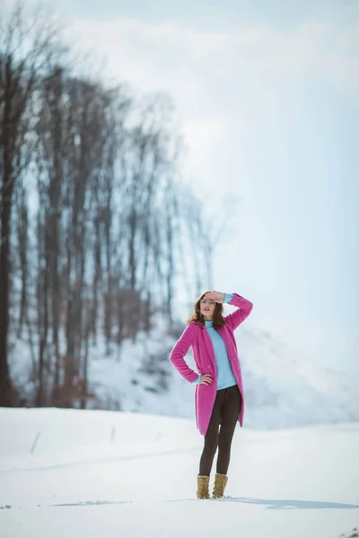 Young Brunette Girl Covering Her Face Sun Wearing Pink Coat — стоковое фото