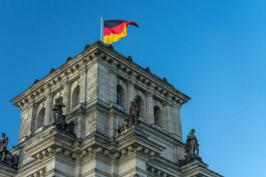 BERLIN, GERMANY May 14, 2020. The Germany flag on the Reichstag Bundestag building. clipart