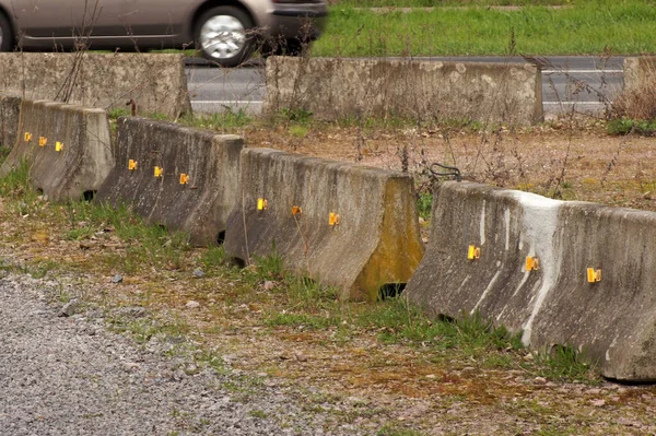 A closeup of concrete barrier in the middle of a