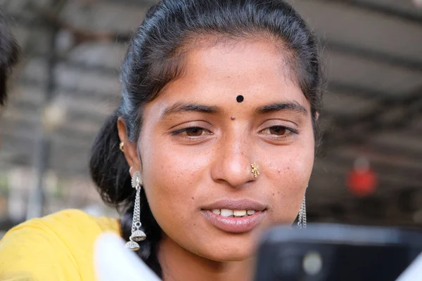 Portrait Young Indian Female Collected Hair Using Her Smartphone — 스톡 사진