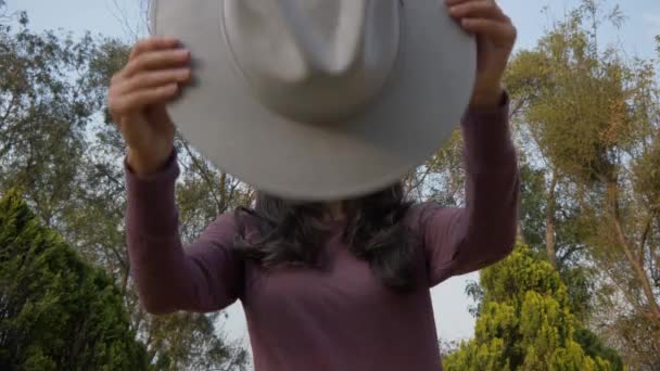 Slow Motion Young Hispanic Woman Putting Her Fedora Hat Throwing — Vídeo de Stock