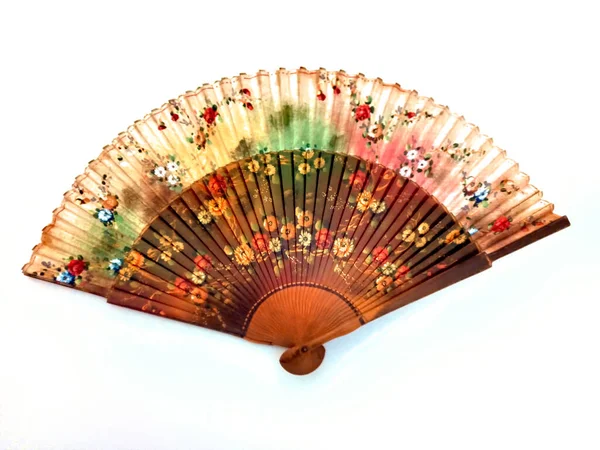 antique Spanish silk hand folding fan decorated with artistic colorful floral designs. Ladies used it for cooling by waving it to create an airflow.