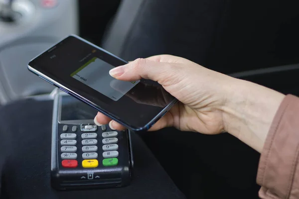 Woman Using Her Mobile Phone Cab Service Pos System — Stock Photo, Image