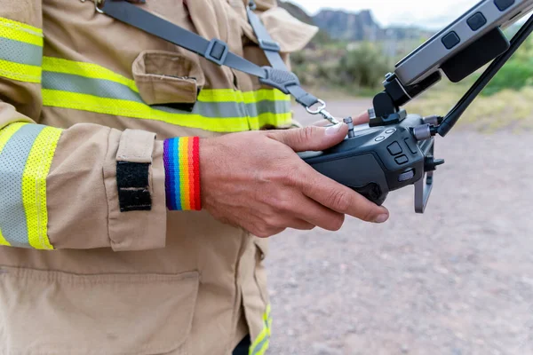 Firefighter Lgbt Bracelet His Wrist Operating Drone Search Rescue — Stock Photo, Image
