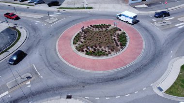A drone view of a roundabout on a sunny day in Eden, North Carolina clipart
