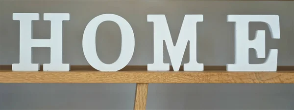 Closeup Shot Home Letters Spelled Top Wooden Bookshelf — Stock Photo, Image