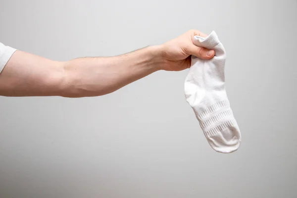 Closeup Shot Male Holding White Sock Plain Background — Stock Photo, Image