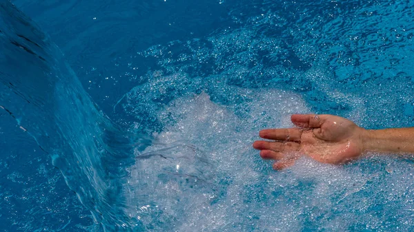 Closeup Shot Person Hand Stream Water Pool — Stock Photo, Image