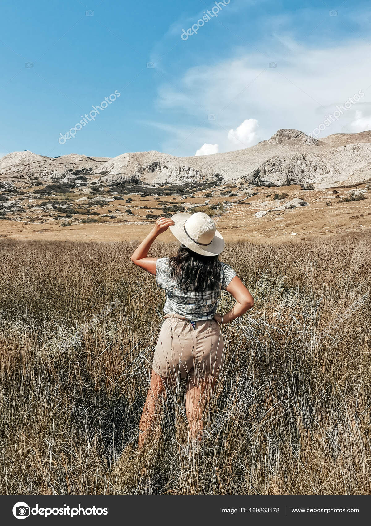 Woman Wearing Earth Tones Summer Clothes Standing Prairie Field 