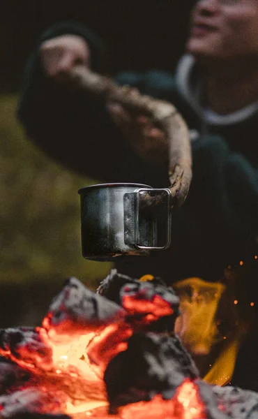 Vertical Shot Man Holding Metal Pot Wood Fire Picnic — Stock Photo, Image