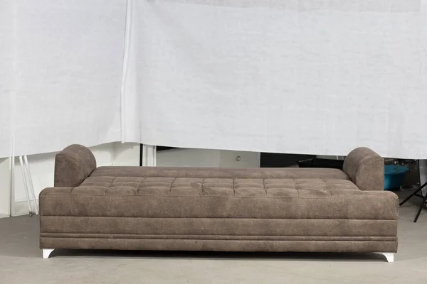 A closeup shot  of a sofa in a white simple living room