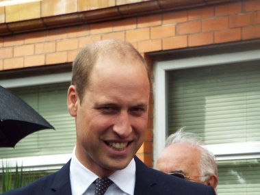 WALLASEY, UNITED KINGDOM - Jan 15, 2015: Seacombe Wallasey Wirral Merseyside united kingdom 01/15/2015 HRH Prince William on a walkabout in Seacombe at local swimming baths. clipart