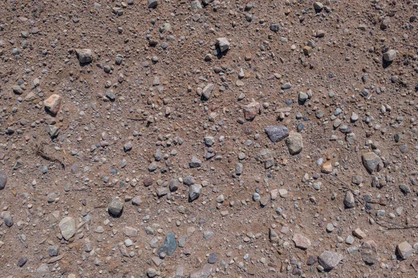 Eine Nahaufnahme Oberflächentextur Mit Kleinen Steinen Auf Schmutzigem Boden — Stockfoto