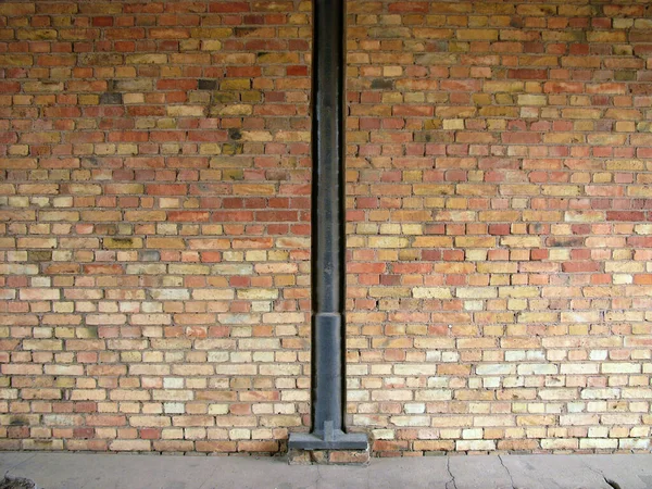Closeup Shot Metal Pipe Brick Wall Background — Stock Photo, Image