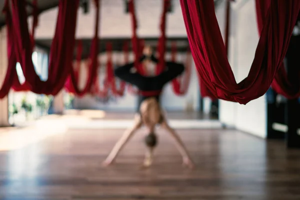 Selective Focus Aerial Yoga Swings Background Flexible Female Practicing Pose — ストック写真