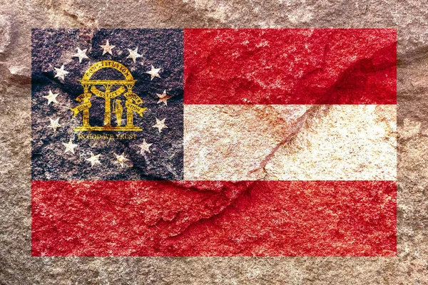 風化した固体岩壁の背景に孤立したジョージア州旗アイコンパターン — ストック写真