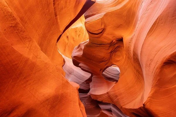 An abstract background of soft orange rock formations of the Antelope slot Canyon in Arizona